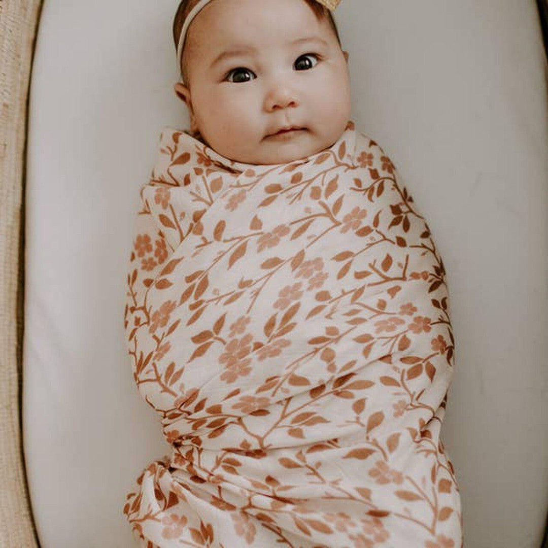 Baby essentials brand on sale swaddle